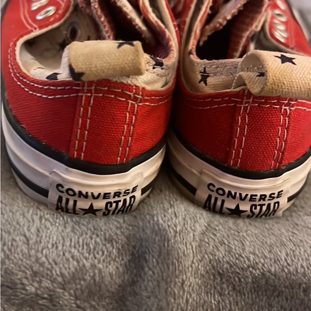 Red Converse double upper slip ons..